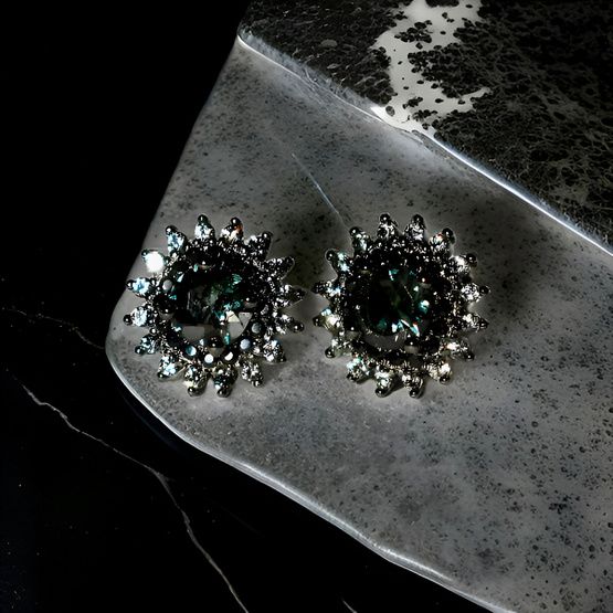 Pendientes de plata de 1ª ley(925 milésimas) con terminación de oro negro en forma de roseta