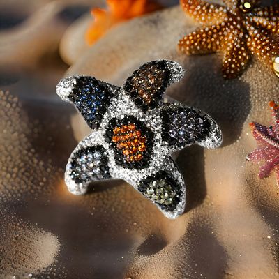 Anillo de plata de 1ª ley(925 milésimas) con terminación de blanco en forma de estrella de mar 