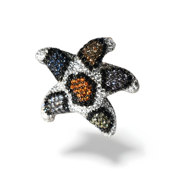 Anillo de plata de 1ª ley(925 milésimas) con terminación de blanco en forma de estrella de mar 