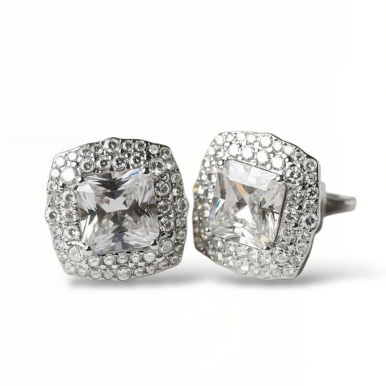 Pendientes de plata de 1ª ley(925 milésimas) con terminación de oro blanco en forma de roseta