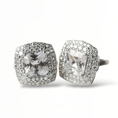 Pendientes de plata de 1ª ley(925 milésimas) con terminación de oro blanco en forma de roseta