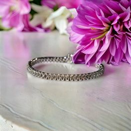 Pulsera rivière plata de 1ª ley(925 milésimas) con terminación de oro blanco 